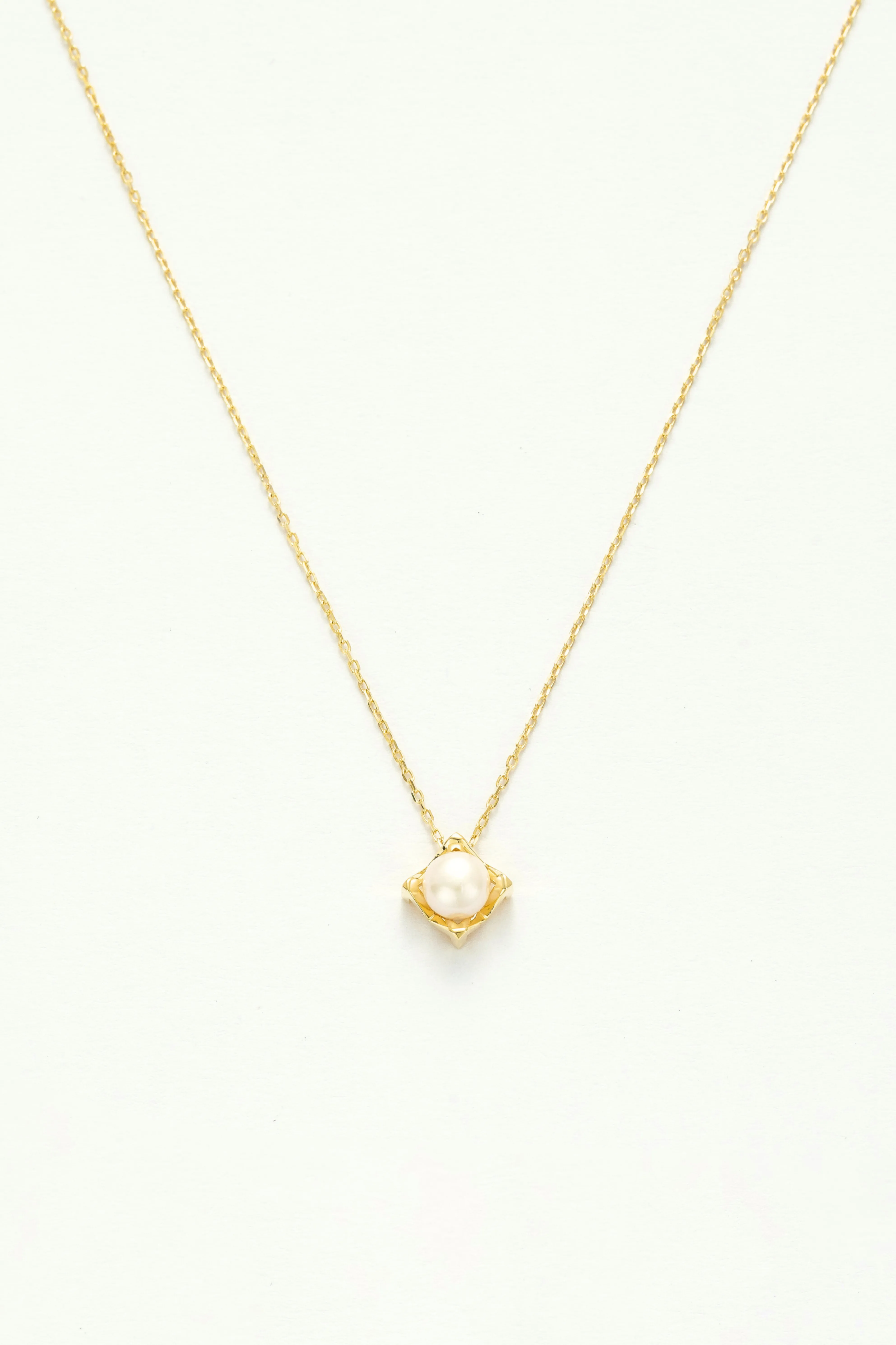 Opulent Pearl Gold Charm Necklace